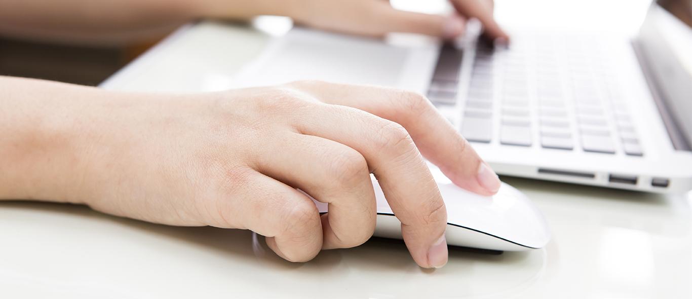 Https consumer 1. Hand typing on Laptop narrow picture. Пишет рука рядом с мышкой затемненная картинка. Internet job ideas. Two handed typing.