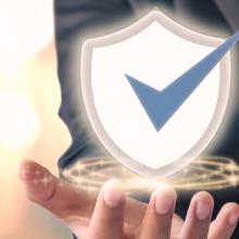 businessman-holding-shield-icon-orange-pokemon-background-cybersecurity-concept-safe-your-data1